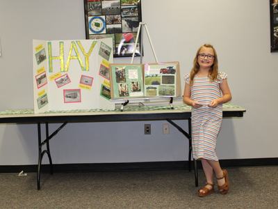 Livestock 4-H Club member Addison Duncan presents about making hay for the 4-H West District Activity Day in May 2021. She represented both her 4-H Club and Caldwell County in the public speaking contest.
