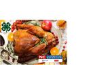 Roasted turkey on platter with 4‑H clover and "NC Cooperative Extension" logo