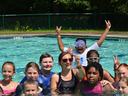 Youth swimming at summer camp