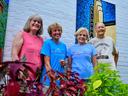 four volunteers pose for photo in downtown Clinton, NC