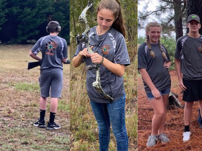 Teens practicing shotgun firing and archery outdoors, group wearing matching team shirts