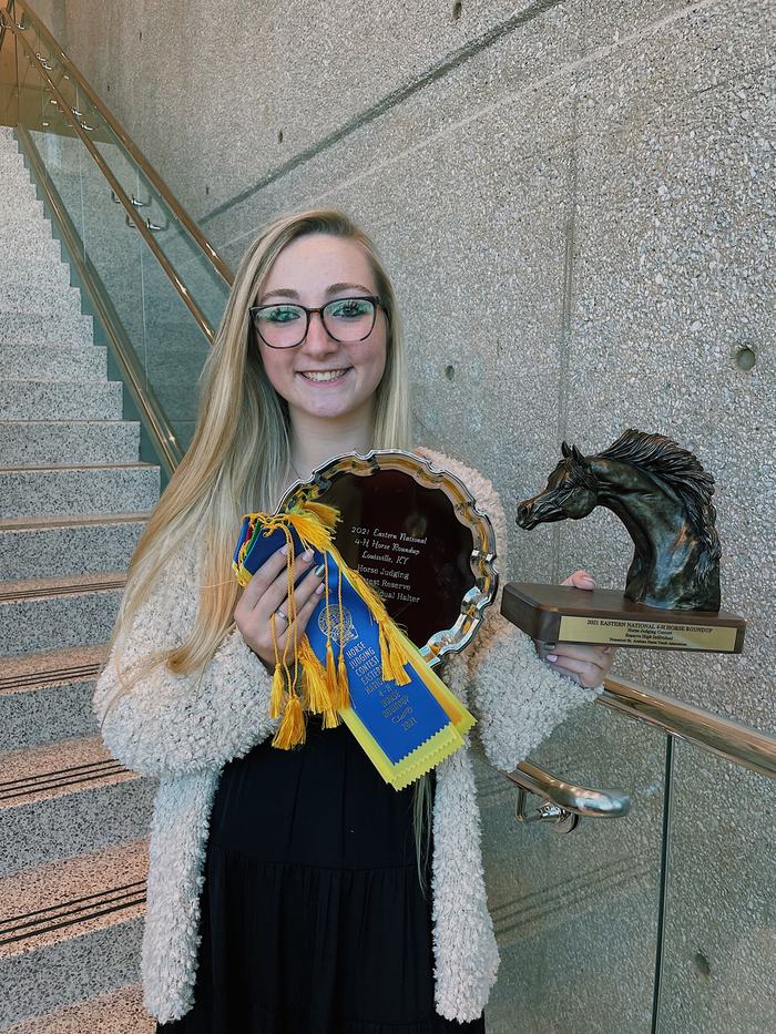 Woman holding awards