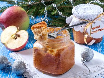 Spiced apple cake baked in clear glass jar.