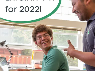 Volunteer and teen work together on the computer. "Enroll in 4-H for 2022!"