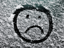 Sad Face in Snow
