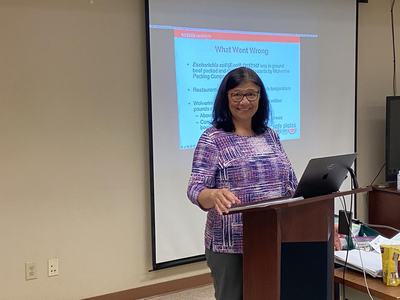 Lady at podium teaching class