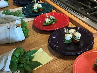 plates with basil, mozzarella and tomato