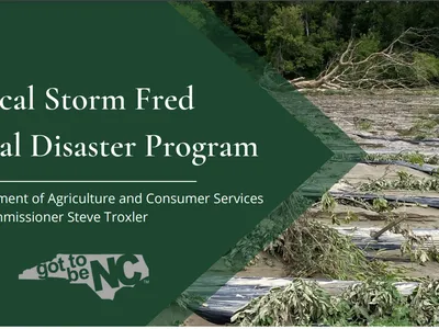 Tropical Storm Fred Agricultural Disaster Program sign with flooded, damaged fields