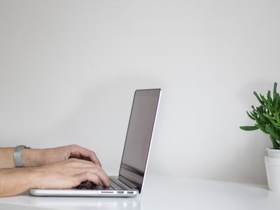 typing on computer at desk