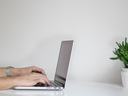 typing on computer at desk