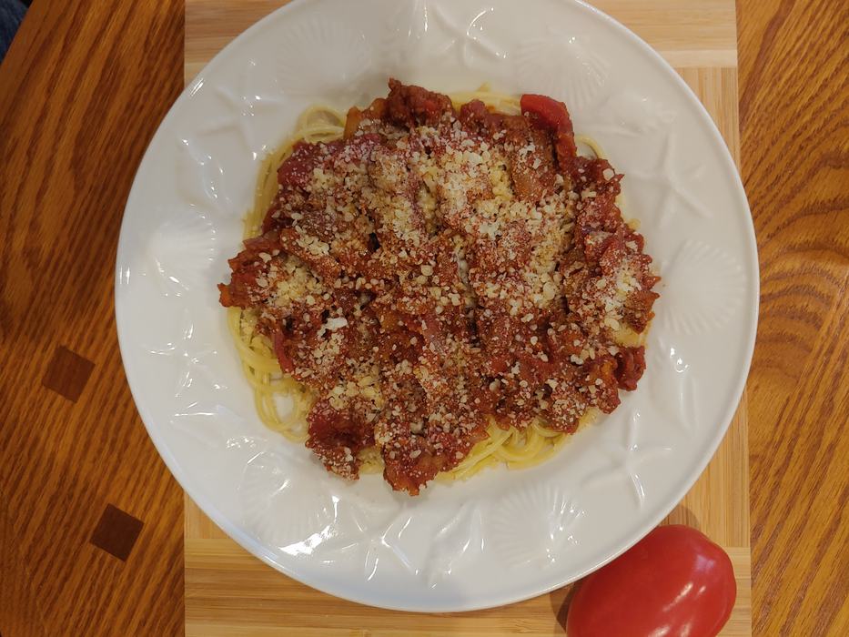 spaghetti with cheese in bowl