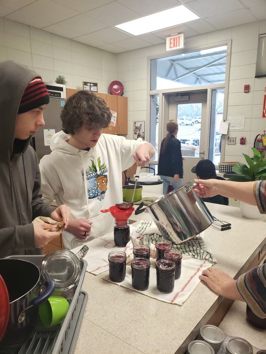 HHS Students learning proper canning techniques