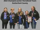 2022 Champion Junior Horsebowl Team Rutherford County: five people with medals, ribbons, plaque