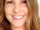 Smiling woman close-up with long light brown hair