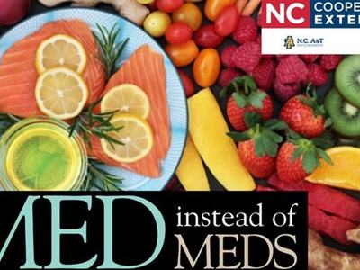 Salmon, lemon, oil and fruit with text "MED instead of MEDS" and NC Cooperative Extension