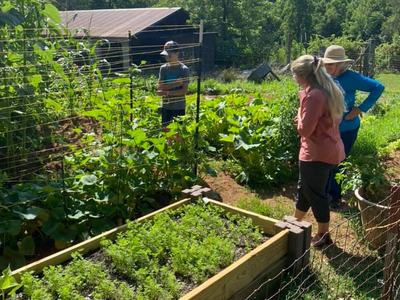 picture of mini garden project participant with judges