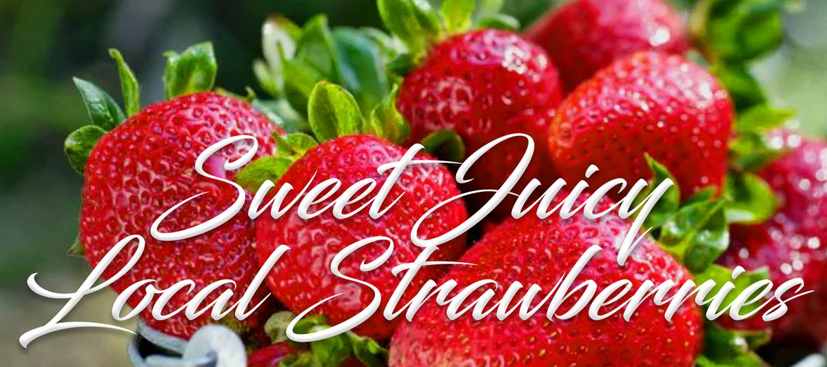 Close-up of ripe strawberries with overlaid text "Sweet Juicy Local Strawberries"