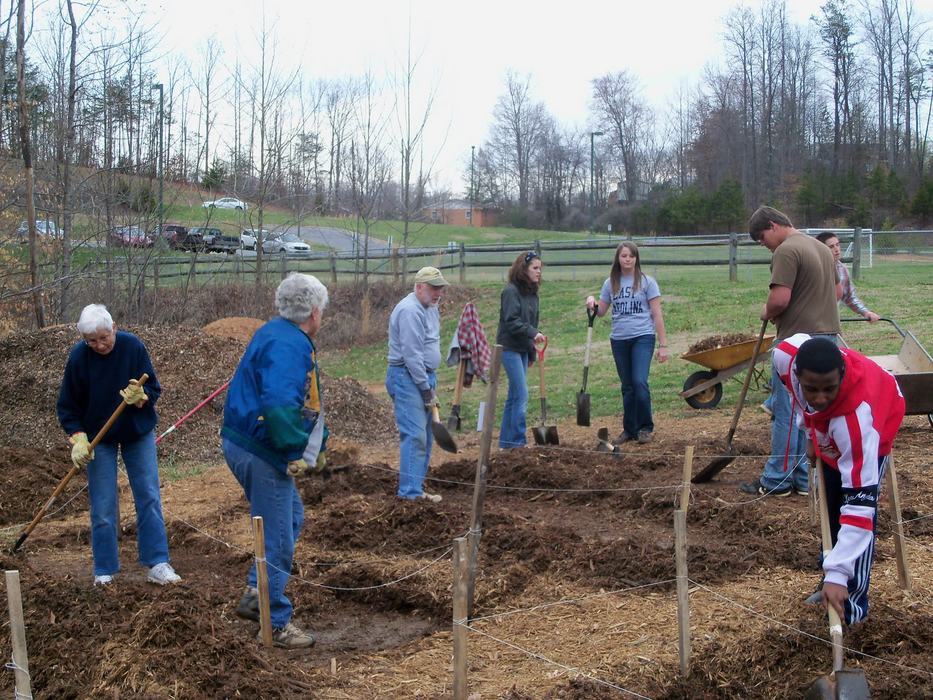 Master Gardener and other volunteers working on a community garden