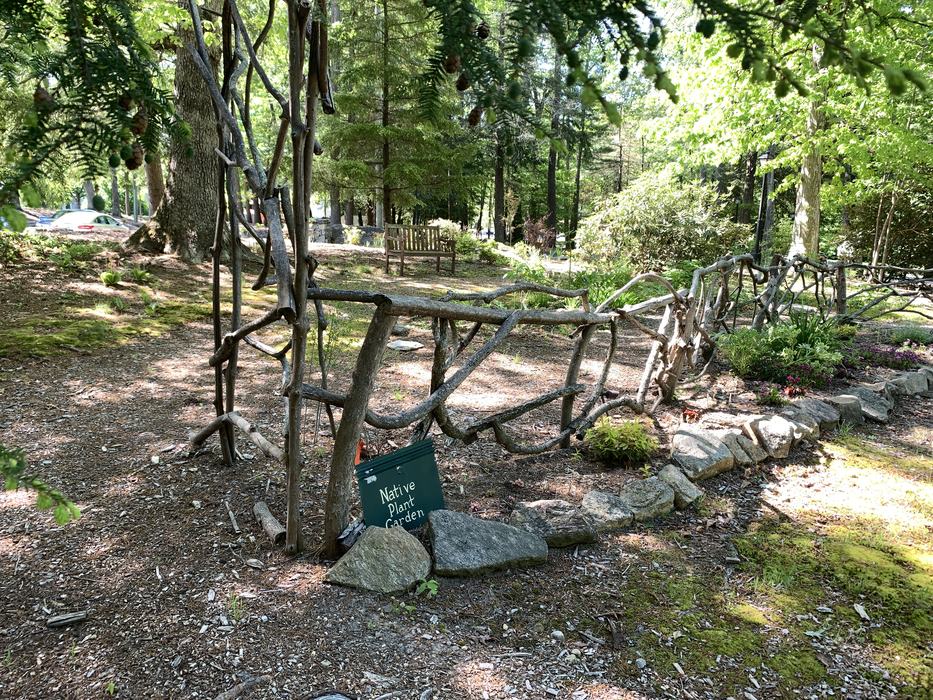 A rustic fence and rock wall.