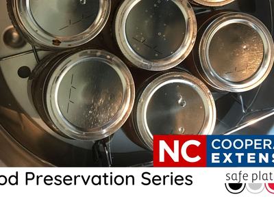 tops of canning jars in canner advertising class