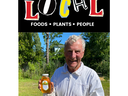 Older man in beekeeping suit holding jar of honey beneath "LOCAL" and "FOODS • PLANTS • PEOPLE"