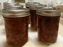 1/2 pint canning jars filled with pepper jelly.
