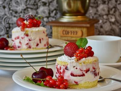 strawberry shortcakes with berries and cherries and coffee