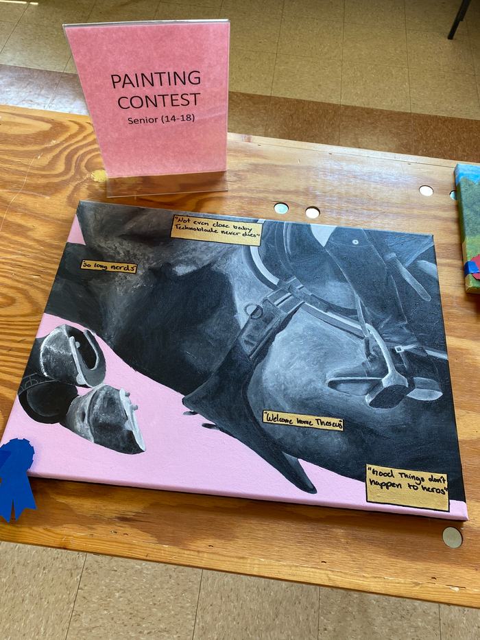 A painting of a black and white horse on a pink background. 