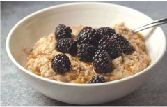 Picture of fresh berry oatmeal. (Photo by Maike form “Cheerful Cook”)