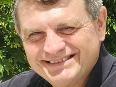 A man smiling at the camera.