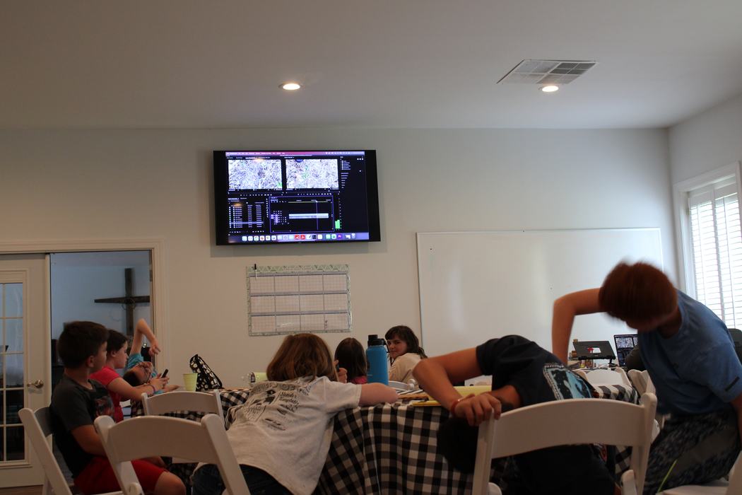 Children learning how to edit films.