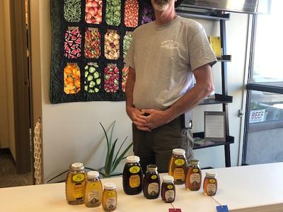 local honey producer with fair ribbons