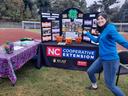 Kaitlyn Lamaster shows off an NCCE display at an event.