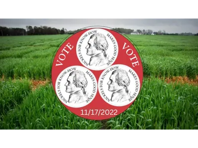 Red circular "VOTE" badge with three Jefferson-profile nickels and date 11/17/2022 over green field