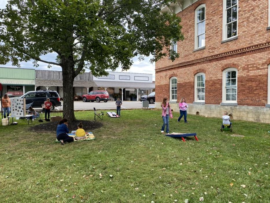 children playing corn hole