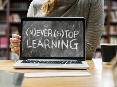 Laptop screen that says Never Stop Learning