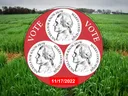 Red circular sign with three nickels, the word "VOTE" and date "11/17/2022" over a green field