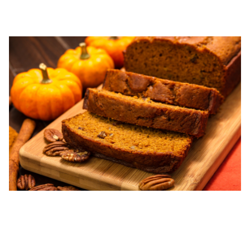 Pumpkin bread on a wooden board.