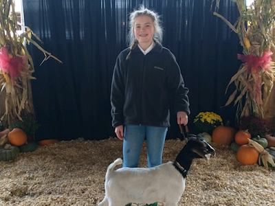 4-H'er with prize winning goat