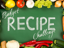 Chalkboard reading "Budget RECIPE Challenge" bordered by assorted fresh vegetables