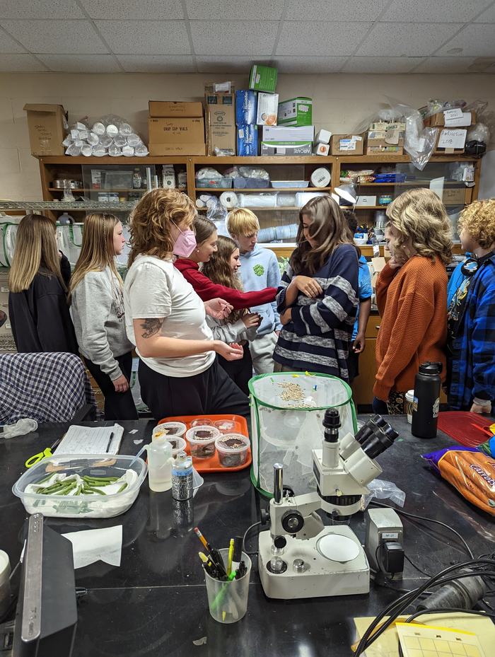 Students in a lab with microscopes.