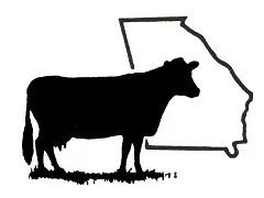 Silhouette of a cow standing in front of the outline of Georgia state