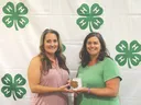 Nicki Carpenter receiving award