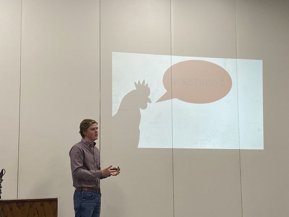 4-H youth giving chicken presentation