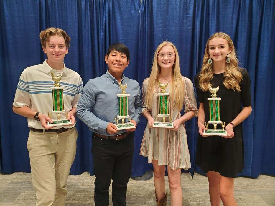 4-H youth winning trophies at National 4-H Poultry & Egg Conference