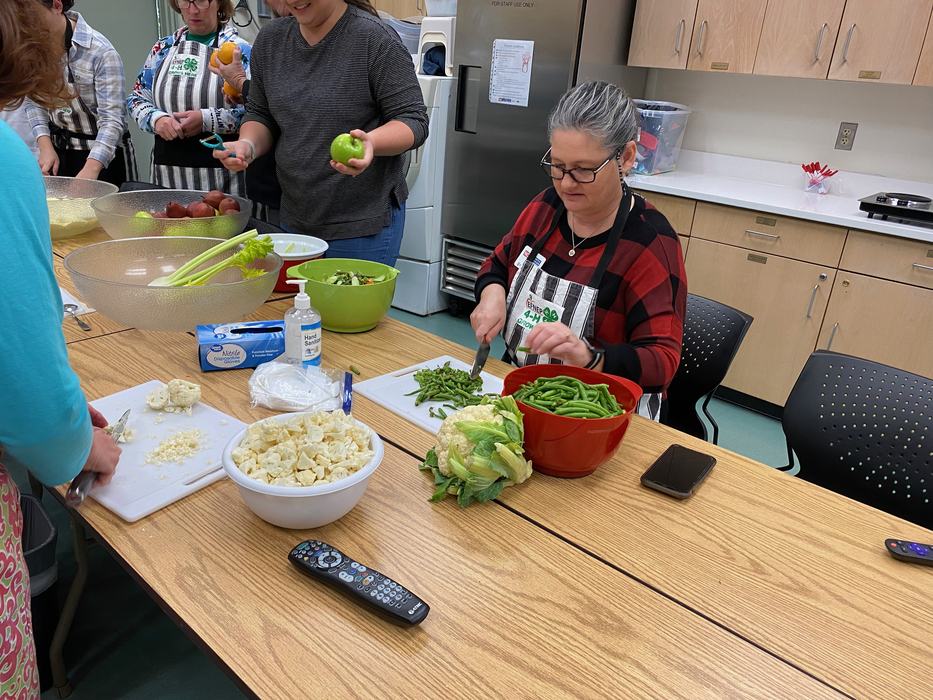 EFNEP educator chopping vegetables 