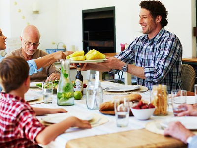 A family sharing a meal at a table.