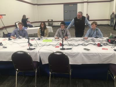youth at quiz bowl table