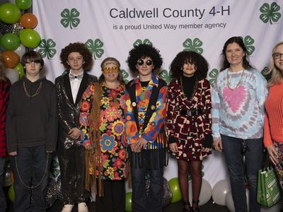 Cooking 4-H Club members and leaders pose at Caldwell County 4-H Achievement Night on February 3, 2023. Pictured from left to right is Debra Woods, Keaton Benfield, Malachi Schwartz, Tiffany Schwartz, Caleb Schwartz, Zoe Woods, Lori Joplin, and Macy Spark