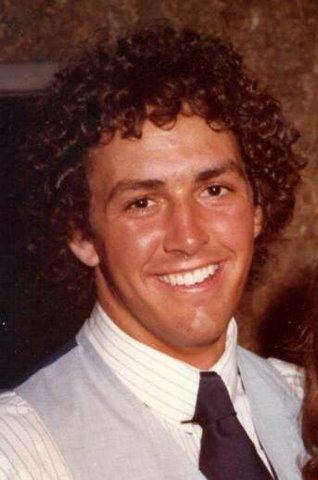 A young man in a shirt and tie.